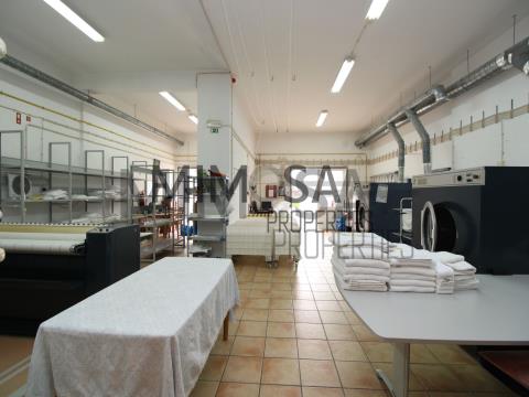 Laundry and building for sale in popular residential area.